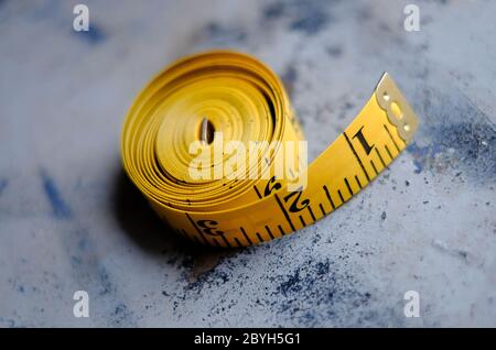 Yellow Tape measure showing measurement in metres and feet Stock Photo ...