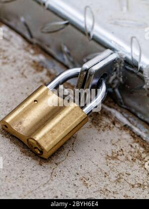 A padlock on an iron door - close-up Stock Photo