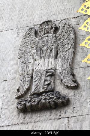 Sculpted stone statue of an angel on the exterior west wall at the ...