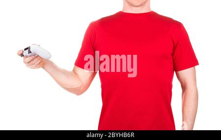 Man in red t-shirt holding video game joysticks gamepad on his palm isolated Stock Photo