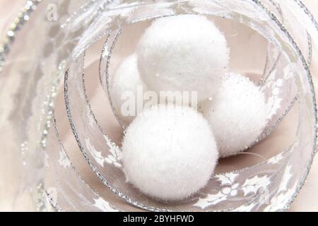 White fluffy New Year's balls and decorative tinse Stock Photo
