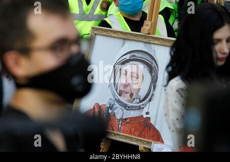 June 10, 2020, Kiev, Ukraine: A painting depicting Ukrainian President Volodymyr Zelensky is seen during a protest of supporters of former Ukrainian President Petro Poroshenko in front the State Bureau of Investigation in Kiev, Ukraine, on 10 June 2020. Former Ukrainian President Petro Poroshenko arrived the State Bureau of Investigation for questioning as a witness in criminal cases. Poroshenko was called for questioning to the State Bureau of Investigation as a witness in the case of alleged illegal movement across the border 43 paintings by famous artists and other cases, according to media Stock Photo