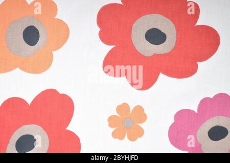 Fragment of colorful retro textile pattern with floral ornament useful as background. Stock Photo