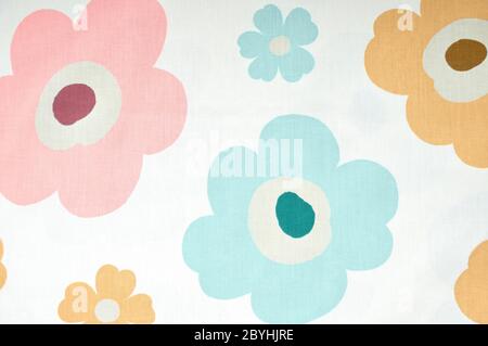 Fragment of colorful retro textile pattern with floral ornament useful as background. Stock Photo