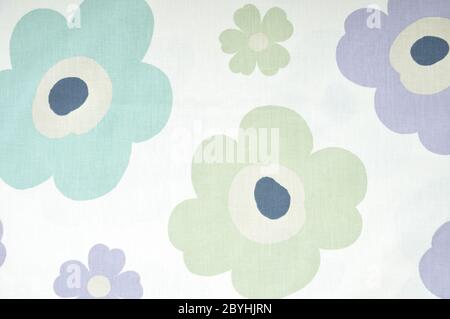 Fragment of colorful retro textile pattern with floral ornament useful as background. Stock Photo