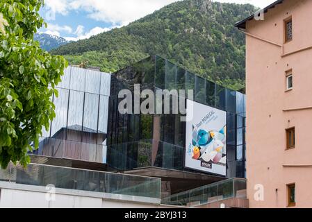 ESCALDES-ENGORDANY, ANDORRA - 2020 juny 8: ArtalRoc in the  River Valira on Engordany Bridge and houses view in a snowfall day in small town Escaldes- Stock Photo