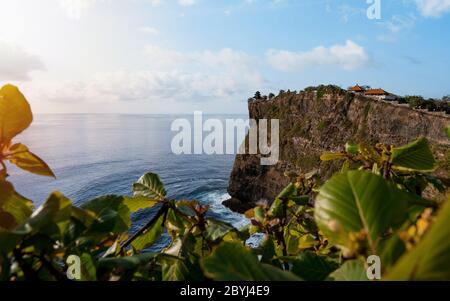 Scenic sea landscape, Bali. High cliff on tropical beach in Bali, Indonesia. Tropical nature of Bali, Indonesia. Beautiful blue sea water, white sand Stock Photo