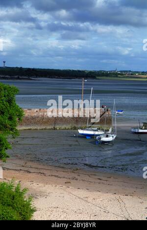 Landscape arround Saint-Jacut-de-la-Mer in Brittany, in France at low tide with boats lying on the sand Stock Photo