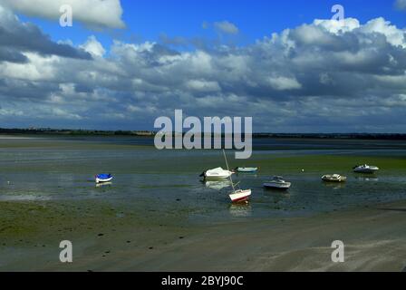 Landscape arround Saint-Jacut-de-la-Mer in Brittany, in France at low tide with boats lying on the sand Stock Photo