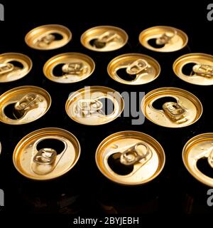 Abstract pattern of opened aluminium cans, top view. Excess drinking, consumerism, alcoholism, or 'be different' concept Stock Photo