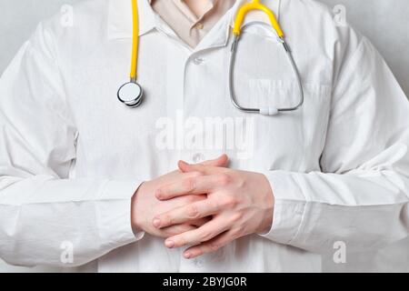 Doctor man in a white coat and with a stethoscope Stock Photo