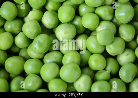 Fresh Sweet Green Peas. Healthy Eating and Vegetarian Concept. Top View of Green Peas. Stock Photo