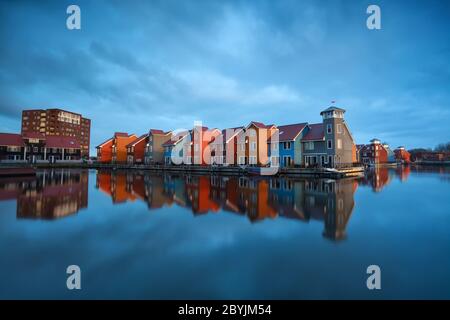 colorful buildings on water in Holland Stock Photo