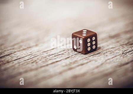 Dice on table, vintage effect. Background for casino games, gambling, luck or randomness. Rolling the dice concept for business risk, chance, good luc Stock Photo