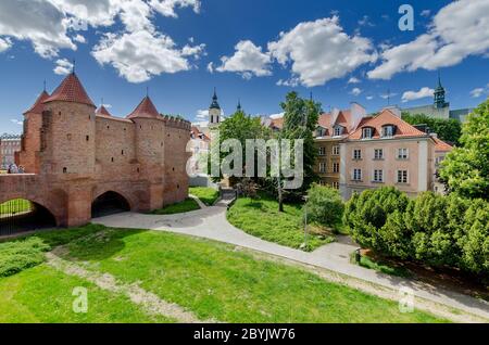 Warsaw, Mazovian province, Poland. View through the moat to the New Town. Barbican fortification on the lef.