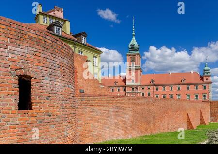 Warsaw, Mazovian province, Poland. View through the moat and defensive walls to the Royal Castle. Old Town district.