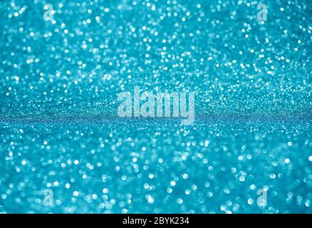 Sparkling lights festive background. Winter card. Glowing magic bokeh Stock Photo