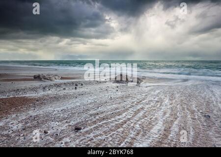 stormy dark sky over Atlantic ocean beach Stock Photo