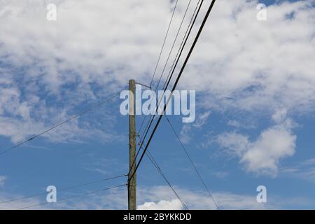Wooden electric pole with wires and grey metal junction box Stock Photo ...