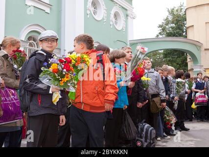 Children with flowers near the School on the first Stock Photo