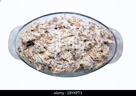 On the plate capital Mayonnaise salad white backgrounds . A family size bowl of healthy coleslaw, made with green and red cabbage, carrot, red onion Stock Photo