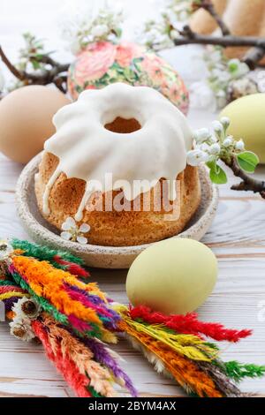 Easter table decorations with eggs, moss and ceramic figurines. Festive decor Stock Photo