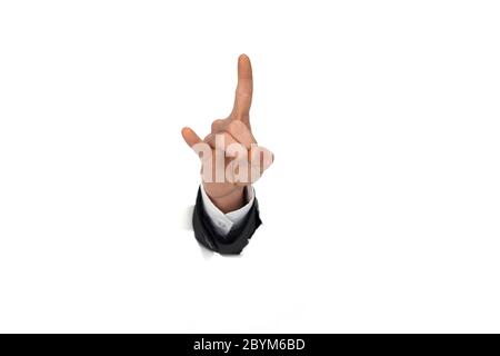 businessman hand breaking through paper wall Stock Photo