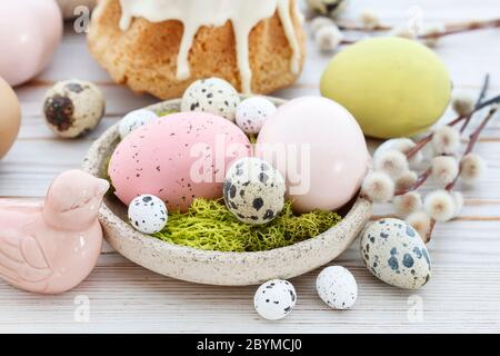 Easter table with cakes, eggs and catkins. Festive decor Stock Photo