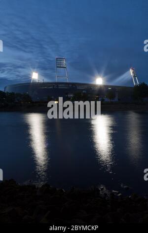 18.05.2020, Bremen, Bremen, Germany - Ghost game at floodlight, Weser stadium of SV Werder Bremen, in front the river Weser. 00A200518D025CAROEX.JPG [ Stock Photo