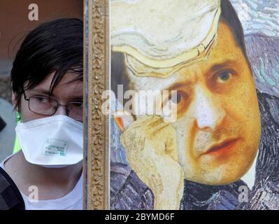 A painting depicting Ukrainian President, Volodymyr Zelensky during the event.Supporters of Former Ukrainian president and the European Solidarity political party leader, Petro Poroshenko set up a symbolic exhibition with portraits of Ukrainian President, Volodymyr Zelensky and top Ukrainian officials and businessmen copulated with paintings of well-known world artists, in a rally showing support to Poroshenko as he arrives for questioning as a witness in criminal cases, outside the State Bureau of Investigation in Kiev. Stock Photo