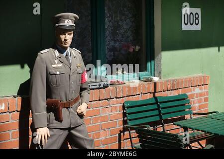 11.05.2019, Proetzel, Brandenburg, Germany - Mannequin in front of an apartment building wearing a uniform of the NVA border troops. 00S190511D313CARO Stock Photo