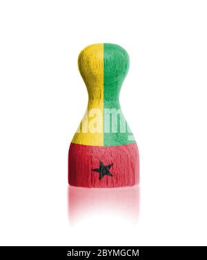 Wooden pawn with a flag painting Stock Photo