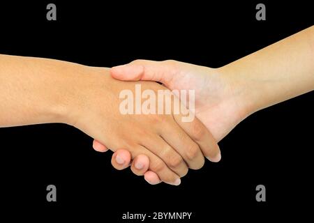 two persons shaking hands on black background Stock Photo