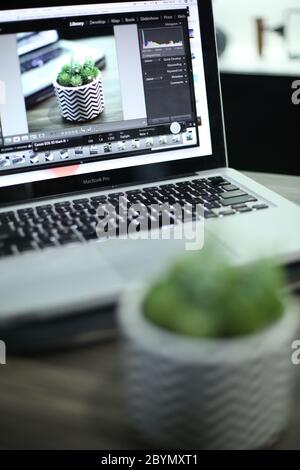 working with computer laptop, working with photo editing software Stock Photo