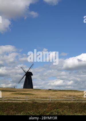 Beacon Mill windmill, standing in a field near the A259 at Rottingdean, East Sussex Stock Photo