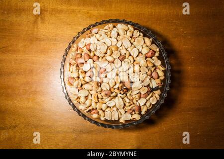 peanuts in bowl on vintage background Stock Photo