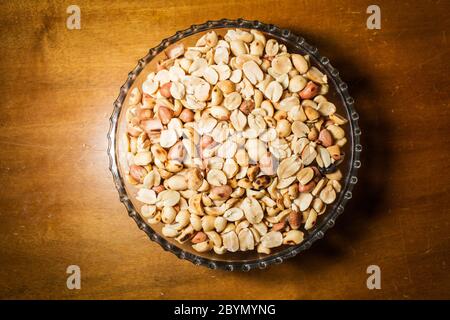 peanuts in bowl on vintage background Stock Photo
