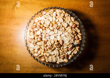 peanuts in bowl on vintage background Stock Photo