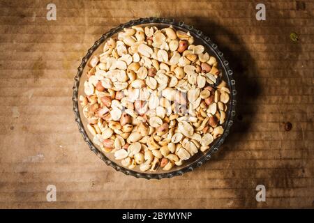 peanuts in bowl on vintage background Stock Photo