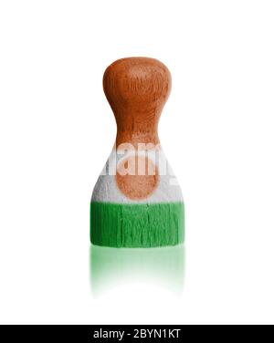 Wooden pawn with a flag painting Stock Photo