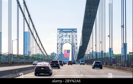 New York, New York - May 25, 2020: George Washington Bridge with the American flag during Memorial Day weekend. Stock Photo