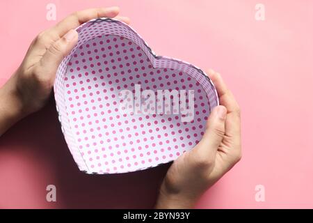 women hand holding empty gift box, top view  Stock Photo