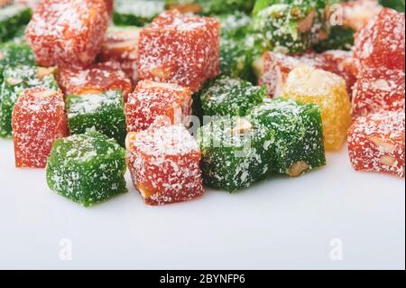 Colorful cubes of Turkish delights on white studio background Stock Photo