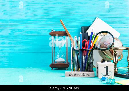 Different school supplies on blue background. Concept Back to school Stock Photo
