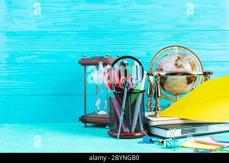 Different school supplies on blue background. Concept Back to school Stock Photo