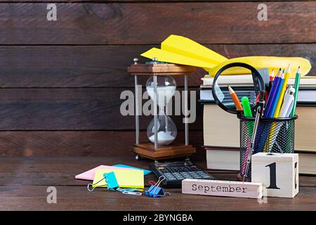 Different school supplies on wooden background. Concept Back to school Stock Photo