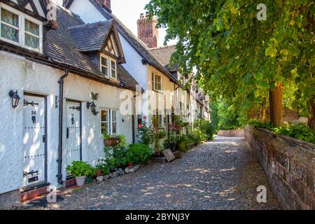 View of old country cottages along an old cobbled lane in the Cheshire rural country  village of Great Budworth Cheshire England UK Stock Photo