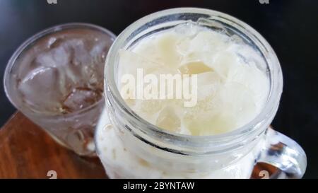 close-up beverage caramel milk in jug with clipping part isolated on black background Stock Photo