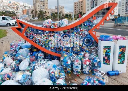Plastic bottle tops recycling collection point in street in Spain Stock Photo