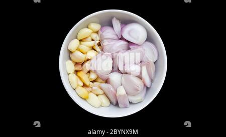 shallot and garlic on white bowl isolated background Stock Photo